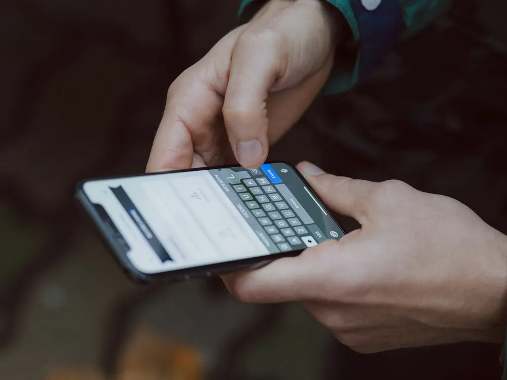 Hands holding a smartphone