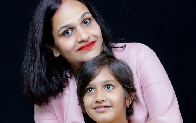 Mother and daughter smiling together