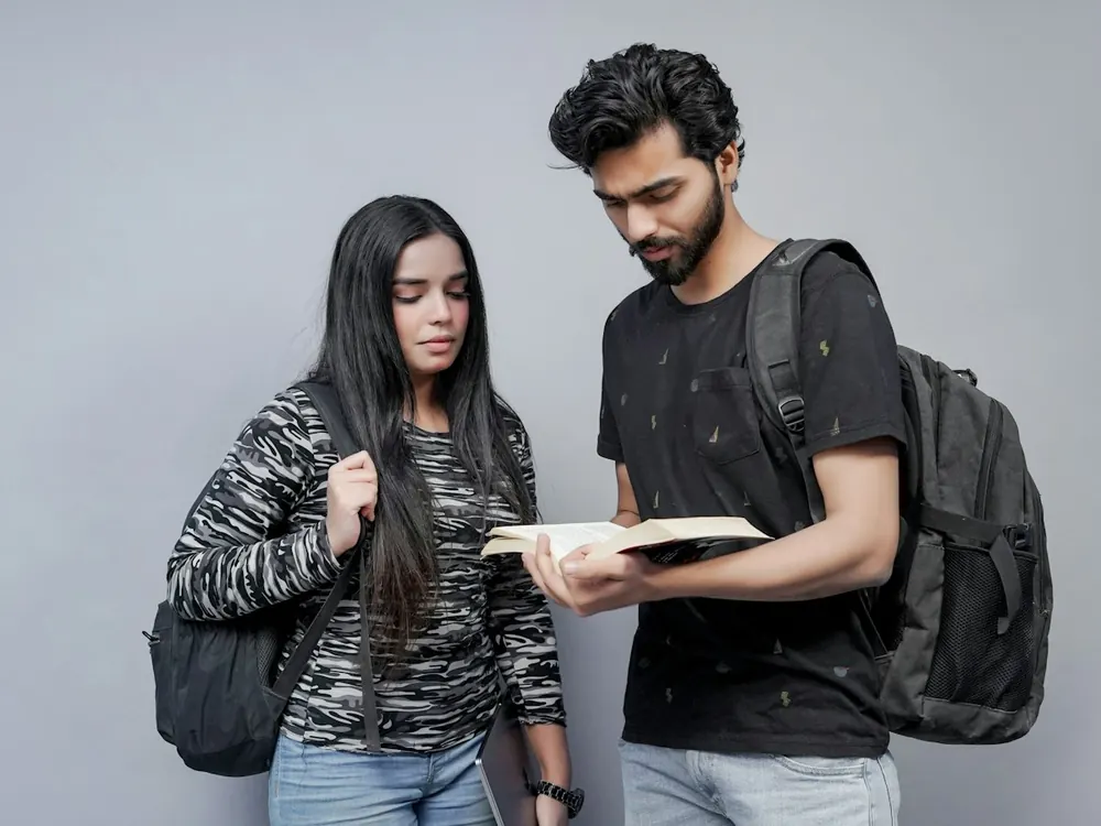 Two students talking about a book